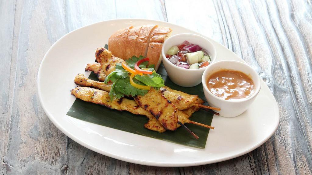 Satay · Gluten free. Savory chicken marinated in yellow curry powder and coconut milk. Served with our homemade peanut sauce and cucumber vinaigrette dipping sauce.