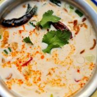 Tom Kha Soup · King mushrooms and scallions, in coconut galangal broth. Spicy.