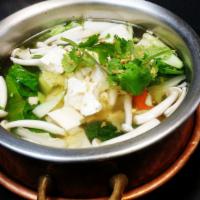 Tom Juad Soup · Napa cabbage, tofu, glass noodles, and scallions in clear broth.