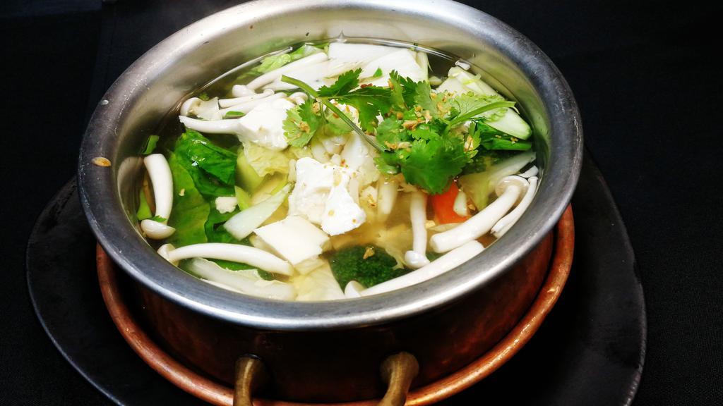 Tom Juad Soup · Napa cabbage, tofu, glass noodles, and scallions in clear broth.