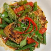 Salmon Prig Khing · Pan-roasted fillet of salmon, chili paste, kaffir lime leaves, string beans and bell pepper....