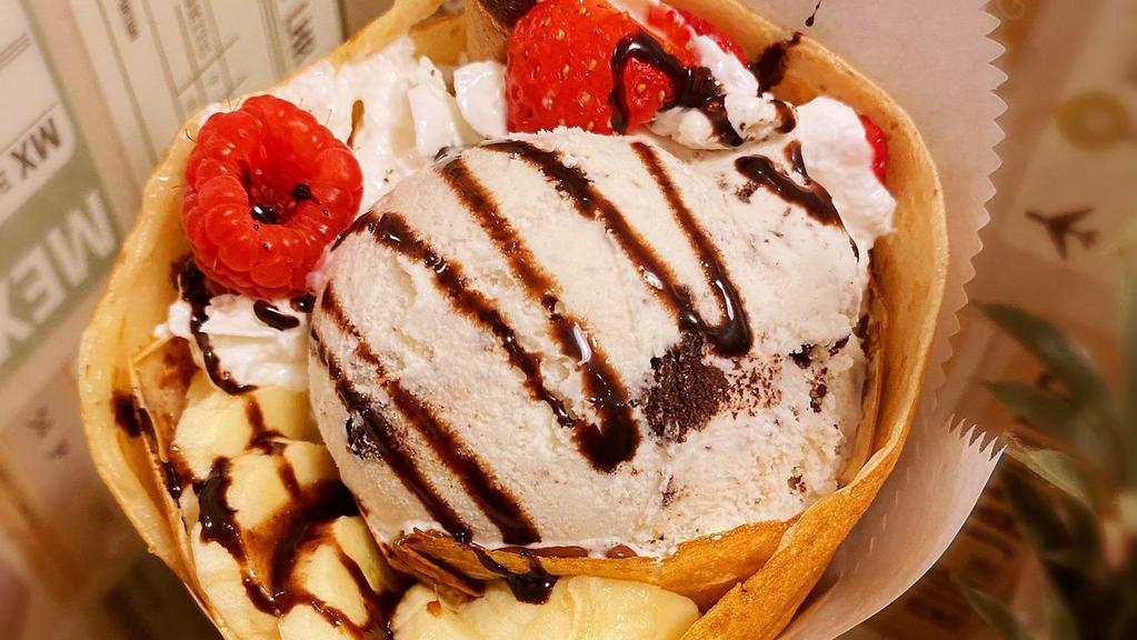 Mojoilla Crepe · Strawberry, banana, red raspberry, Nutella​, chocolate syrup, and cookie cream ice cream.