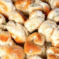 Garlic Knots · 6 garlic knots with sauce on the side