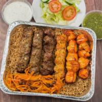 # 33 Family Combo (3-4 People) · Serves three to four people. Two chicken tikka, two beef kofta, one beef tikka, and one chic...