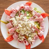 Chef Salad · American salad consisting of hard-boiled eggs, meat, tomatoes, cucumbers, and cheese, all pl...