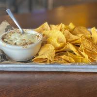 Spinach Artichoke Dip · A 90 s throwback! But this isn’t your average spin dip. Spinach and artichokes baked to bubb...
