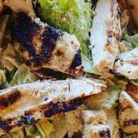 Caesar Salad · Fresh Romaine hearts, shaved parmesan, croutons, and grilled pita. Tossed in our steakhouse ...