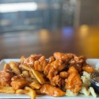 Boneless Wing Platter · An order of our boneless wings tossed in a wing sauce of your choice over macaroni salad and...