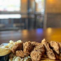 Finger Platter · Crispy or grilled chicken tenders over macaroni salad and French fries. Served with honey mu...