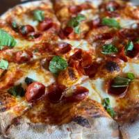 Honey Pie · Red sauce base, cup & char pepperoni, fresh mozzarella, topped with fresh basil & hot honey!