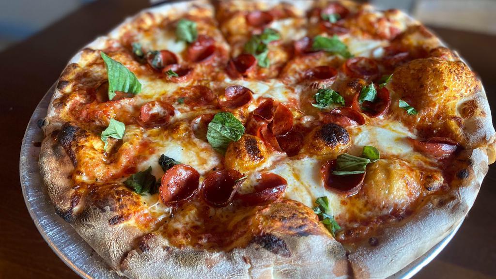 Honey Pie · Red sauce base, cup & char pepperoni, fresh mozzarella, topped with fresh basil & hot honey!