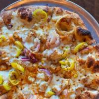 Buffalo Chicken Pizza · Mild wing sauce, chicken tenders, banana peppers, red onion, mozzarella, and crumbled blue c...