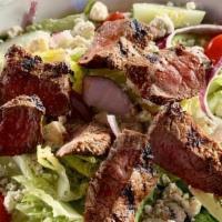 Black And Blue Salad · Chopped Romaine, red onion, cucumber, tomato, crumbly blue, and sliced steak.