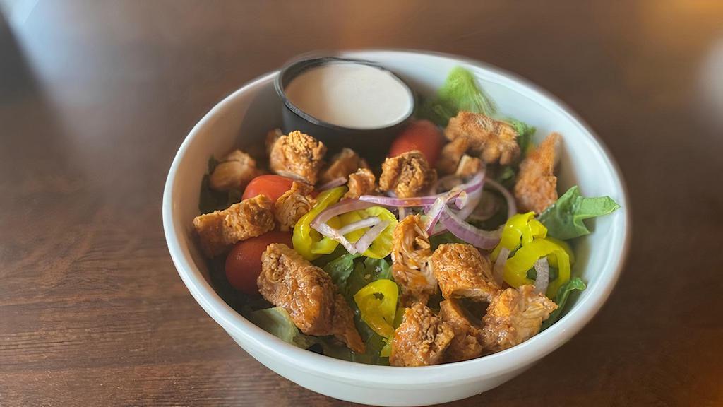 Buffalo Chicken Salad · Chicken tenders, grape tomatoes, red onion, banana peppers, crumbly blue, and ranch dressing.