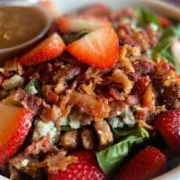 Strawberry Salad · Spinach, bacon, crumbly bleu cheese, fresh strawberries, candied pecans, served with balsami...