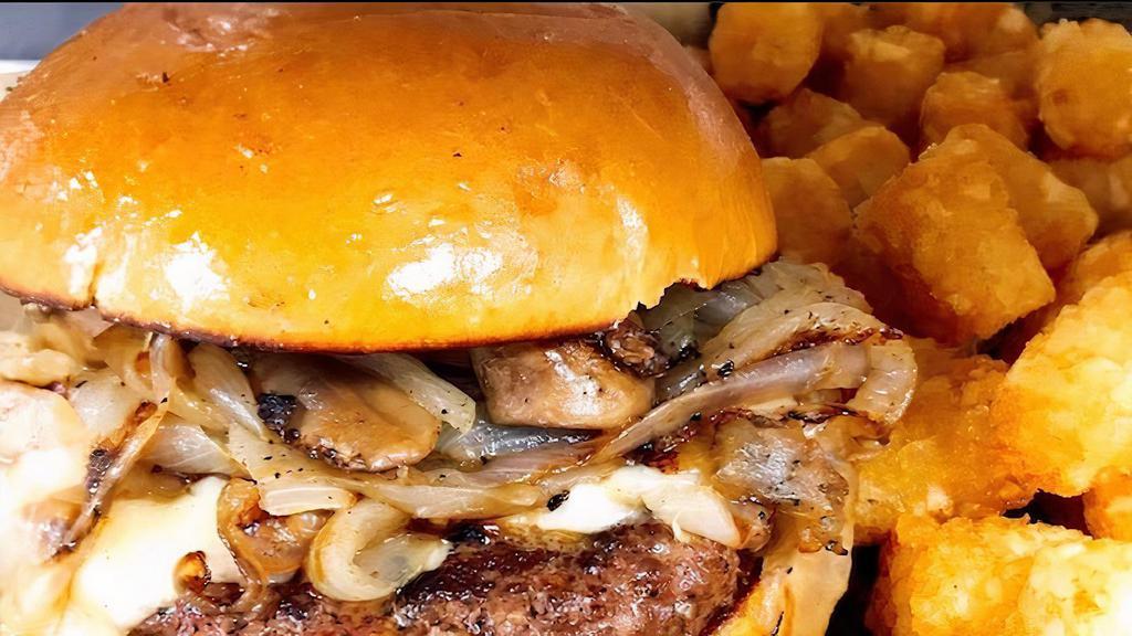 Mushroom Swiss Burger · A small twist on a classic-Swiss cheese, sautéed mushrooms, and onions topped with garlic aioli. Served “pink or no pink” with French fries.