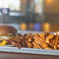 Breakfast Burger · Topped with local Cheddar, fried egg, and bacon. Served “pink or no pink” with French fries.