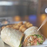 Buffalo Chicken Wrap · Grilled or crispy chicken tossed in your choice of buffalo sauce, lettuce, tomato, and Chedd...