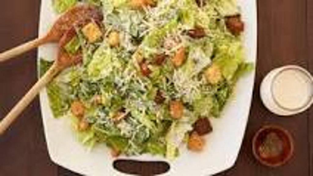 Caesar Salad (Small) · Romaine lettuce, croutons and Parmesan cheese mixed with Caesar dressing. Served with pita.