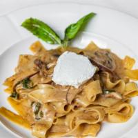 Pappardelle Con Funghi · Homemade pasta, wild mushroom ragu, truffle oil and goat cheese.