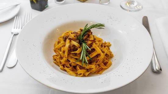Fettuccine Con Ragu · Homemade pasta, tomato and tuscan lamb ragu.