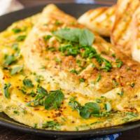 Cheese Omelette · Three eggs mixed with customers choice of cheeses.