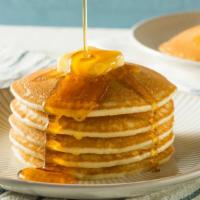 Buttermilk Pancakes · Fluffy buttermilk pancakes served with syrup and butter.