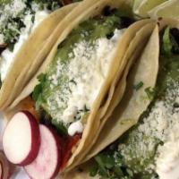 Vegetarian Taco · With rice, beans, cheese, lettuce, grilled vegetables, sour cream and guacamole. (Only corn ...