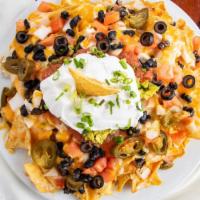 Beachboy Nachos · corn tortilla chips topped with fresh diced tomatoes, onions, black olives, jalapenos, black...