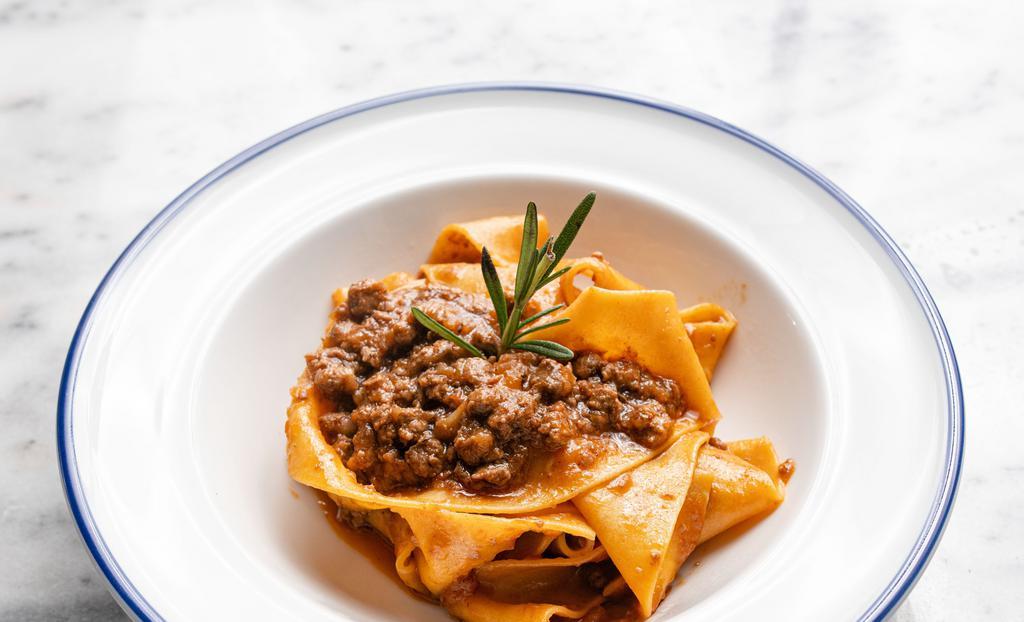 Pappardelle Al Ragu · Slow cooked beef ragu bolognese style.