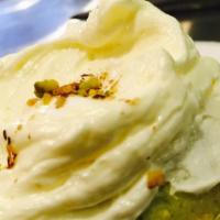 Pistachio Cupcake · Pistachio cake with satin buttercream with a pistachio on top.