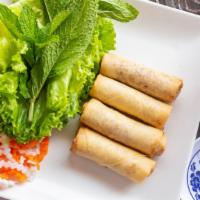 Cha Gio · Spring roll. Vietnamese pork spring roll served with green leaf lettuce, mint leaves, and di...