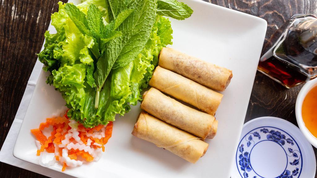 Cha Gio Chay · Vegetarian spring roll. Vietnamese vegetable spring roll served with green leaf lettuce, mint leaves, and dipping sauce.