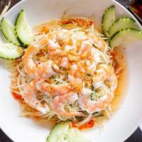Goi Du Du · Papaya salad. Fresh shredded papaya and carrots with Vietnamese herbs topped with grilled sh...