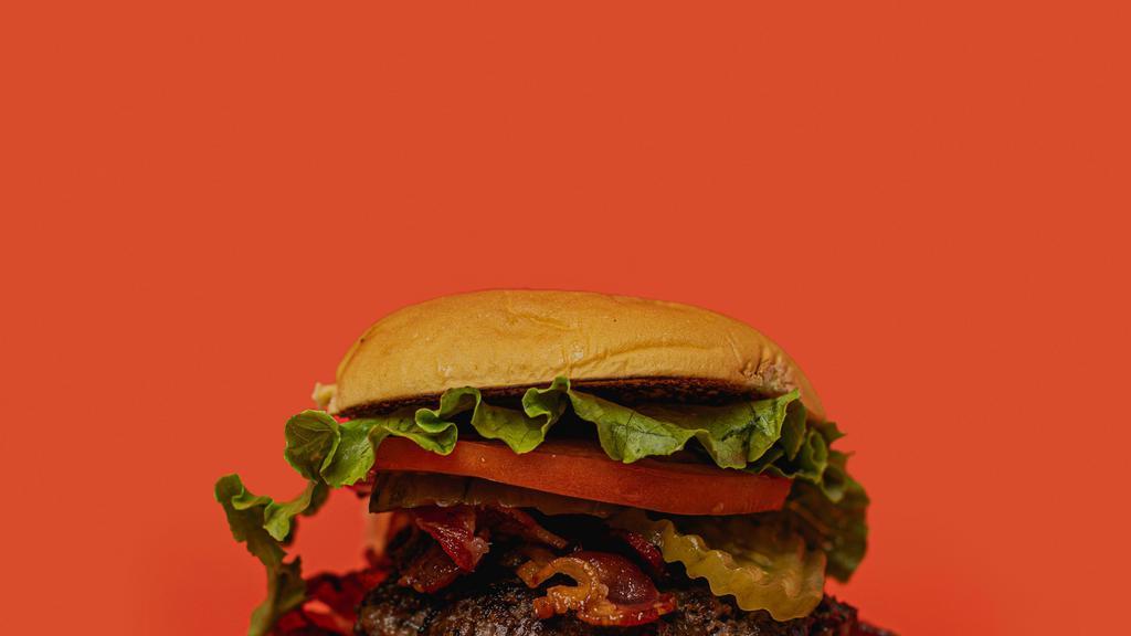 Double Hamburger · Two Pat Lafrieda Brisket Blend smashed burger patties served with green leaf lettuce, tomato, pickle, onions, and special sauce on golden potato buns. Chef recommendation: add bacon.