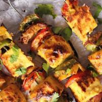 Paneer Tikka · Home-Made Cottage Cheese With Onion And Green bell pepper Spices Cooked.
