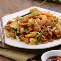 Penang Char Kway Teow 槟城炒粿条 · Spicy. Stir- Fried Flat Rice  Noodle.