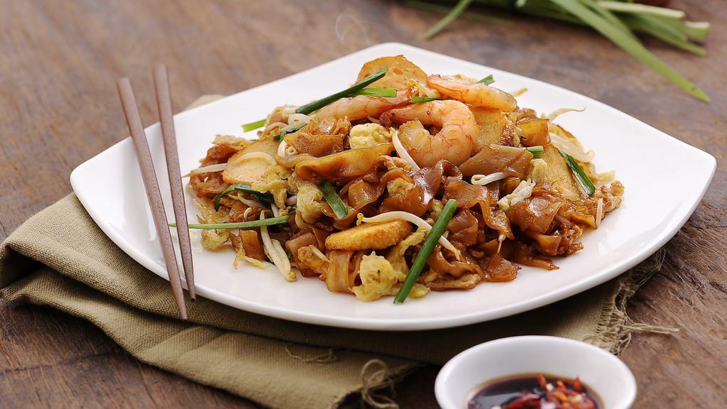 Penang Char Kway Teow 槟城炒粿条 · Spicy. Stir- Fried Flat Rice  Noodle.