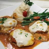 Veal Sorentino · Veal Scaloppine tossed with eggplant, prosciutto and melted mozzarella in a light red sauce.