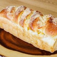 Chestnut Pan Bread · Sweet loaf of roll bread with chestnut pieces embedded in every layer, topped with sweet pea...