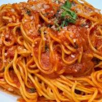 Spaghetti Alla Chitarra · tomato / basil / parmigiano