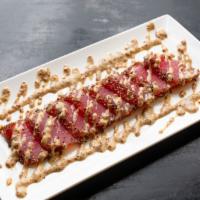 Black Pepper Tuna · Seared sashimi tuna coated with black pepper, served with mustard sauce. Packed separately w...