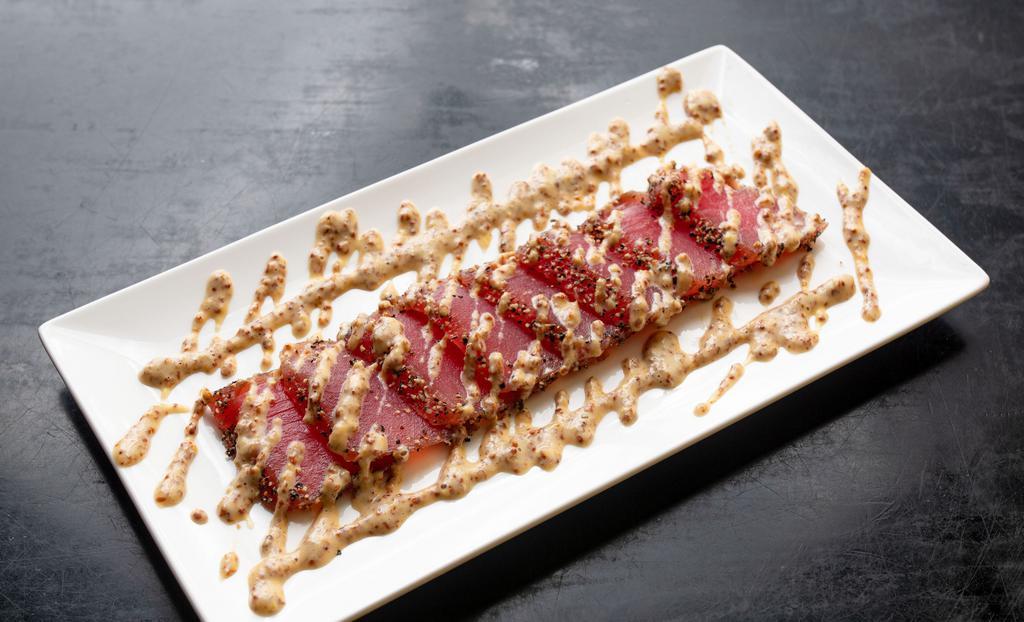 Black Pepper Tuna · Seared sashimi tuna coated with black pepper, served with mustard sauce. Packed separately with dry ice, always cool & fresh.