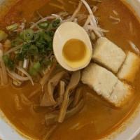 Kome Miso Ramen · Kome miso, pork and chicken-based soup. Topped with ground pork, bean sprouts, scallion, cor...