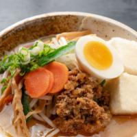 Shiro Miso Yasai Ramen · Extra vegetables. Shiro miso, pork and chicken-based soup. Topped with ground pork, bean spr...