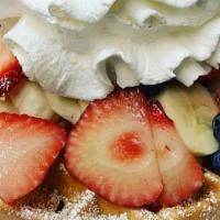 Red, White And Blue Waffle · Fresh Strawberries, Bananas, and Blueberries topped with Powdered Sugar and Whipped Cream.
