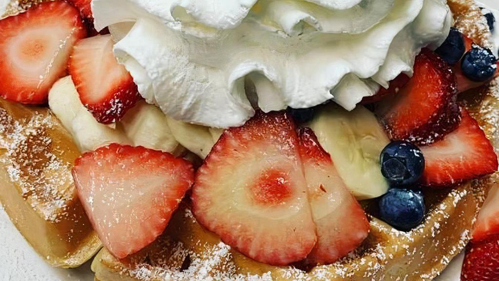 Red, White And Blue Waffle · Fresh Strawberries, Bananas, and Blueberries topped with Powdered Sugar and Whipped Cream.