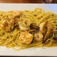 Shrimp Scampi · Jumbo shrimp sautéed in garlic and white wine finished with fresh lemon
juice served over li...