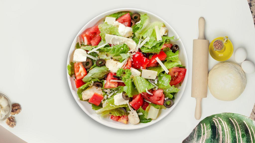 In The House Salad · Romaine lettuce, mixed baby greens, vine tomatoes, bermuda onions, cucumbers, black olives, green and red peppers with Italian Dressing.