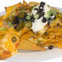 Loaded Nachos · tortilla chips • cheddar cheese • chili • jalapenos • black olives • scallions • sour